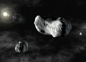 огромный астероид, окруженный двумя спутниками